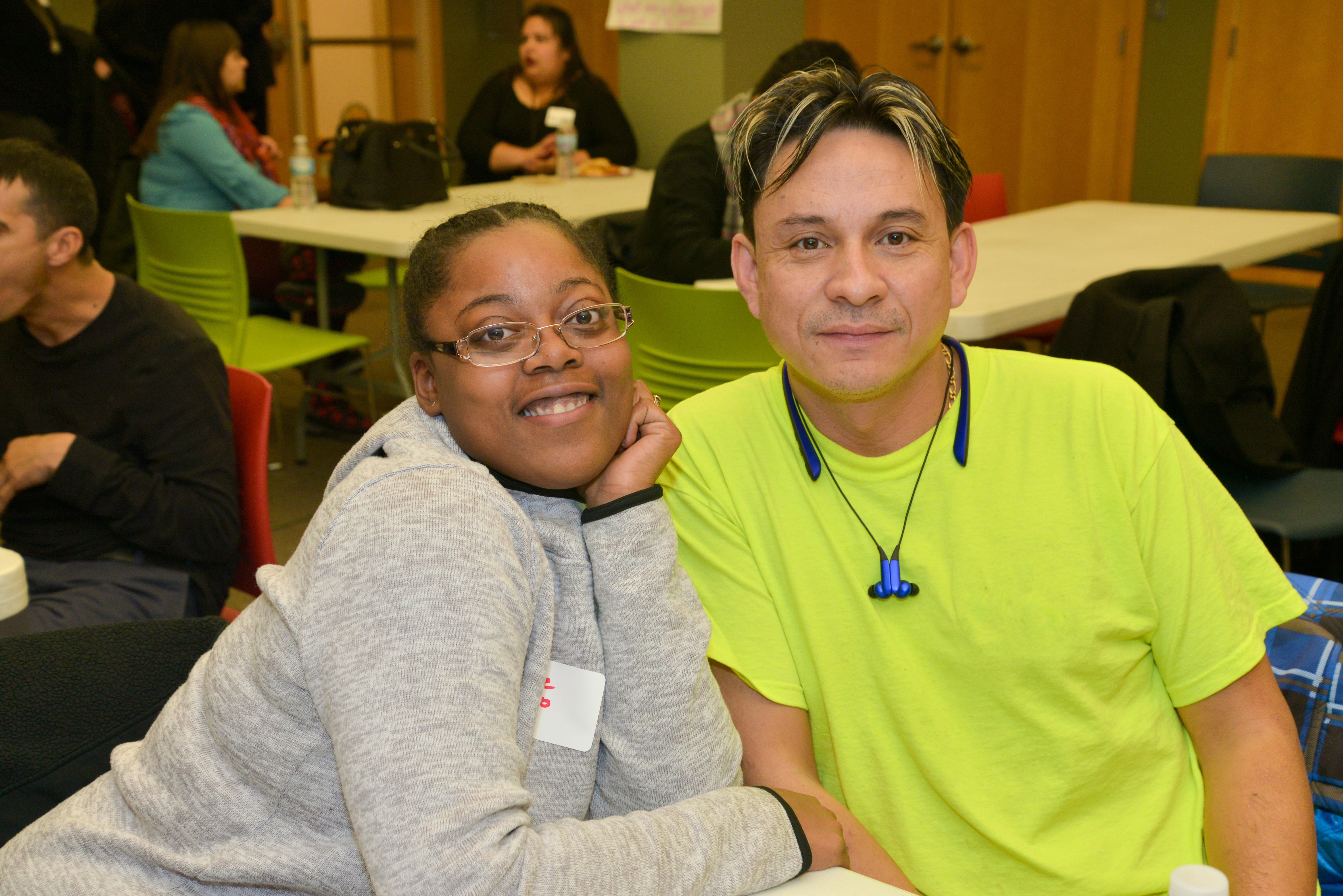 Pictire of two community members looking directly into the camera.